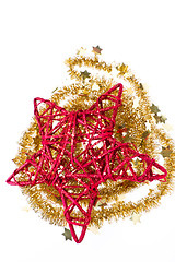 Image showing red christmas star with golden tinsel