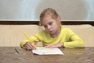 Image showing Girl has thought of drawing.