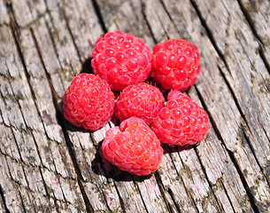 Image showing Raspberries on wood