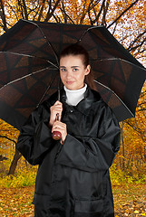 Image showing woman in rain coat