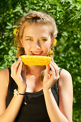 Image showing woman eating corn-cob