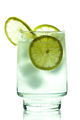 Image showing Glass of gin and tonic with ice cubes and lime slices