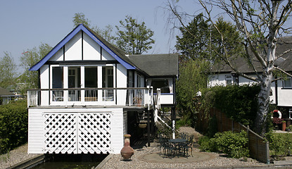 Image showing thatched cottage with a boat house