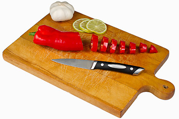 Image showing Chopping Board with pepper lime and garlic