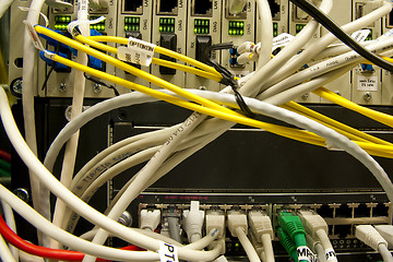 Image showing Fiber cables connected to servers 