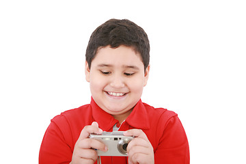 Image showing small boy with digital camera on white background 