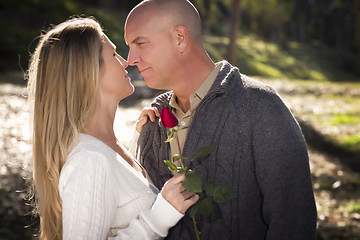 Image showing Attractive Young Couple with Rose