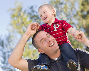 Image showing Young Laughing Father and Child Piggy Back