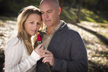 Image showing Attractive Young Couple with Rose