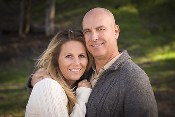 Image showing Attractive Couple Wearing Sweaters in Park