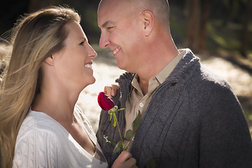 Image showing Attractive Young Couple with Rose