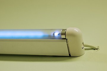 Image showing Fluorescent lamp shining on white studio ground