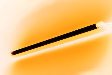 Image showing Fluorescent lamp shining on smooth colored wall