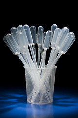 Image showing Pack of pipettes standing in measure glass