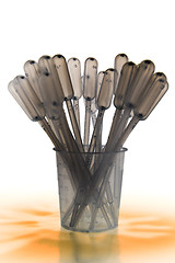 Image showing Shaded pipettes standing placed in measure glass