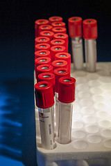 Image showing Red test tubes placed at curved lines