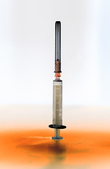 Image showing Shaded medical syringe standing head up