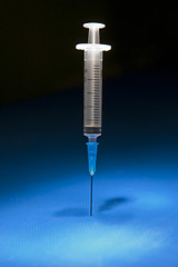 Image showing Ready medical syringe standing head down