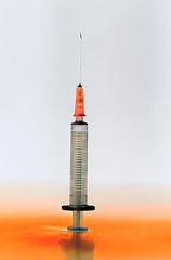 Image showing Shaded medical syringe standing head up