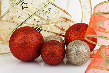 Image showing Gold and red Christmas baubles.