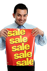 Image showing Retailer with sale sign