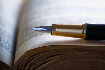 Image showing Old book and pen