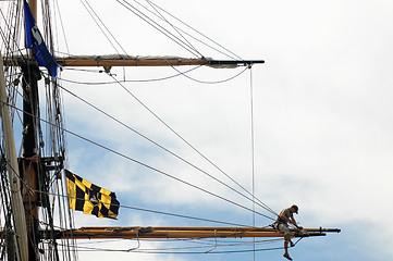 Image showing Sailor working on tall ship's mast