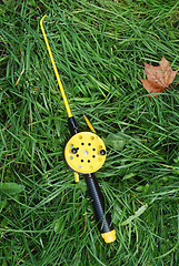 Image showing fishing rod with yellow reel  