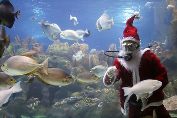 Image showing Santa Clause Feeding Fishes