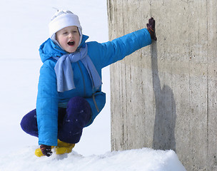 Image showing Young girl near the concrete wall