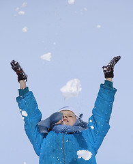 Image showing Young girl playing with snow