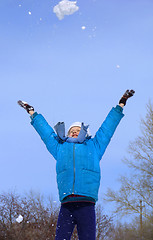 Image showing Young girl playing with snow