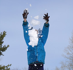 Image showing Young girl playing with snow
