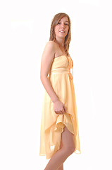 Image showing Teenager girl lifting dress.