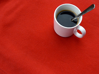 Image showing Coffee cup on red