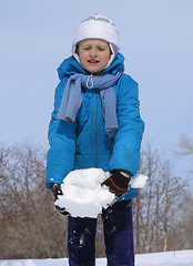 Image showing Young girl playing with snow