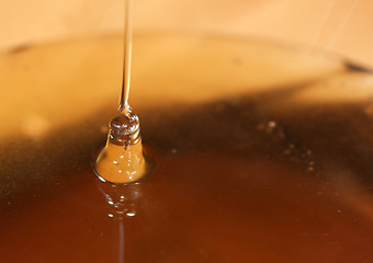 Image showing pouring honey