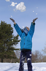 Image showing Young girl playing with snow