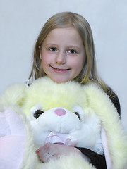 Image showing Happy young girl with lovely toy