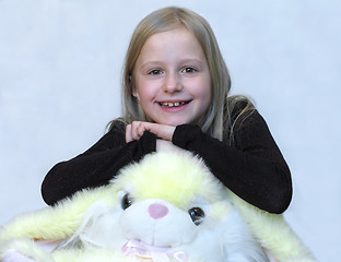 Image showing Happy young girl with lovely toy