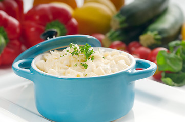 Image showing mac and cheese on a blue little clay pot