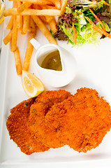 Image showing classic Milanese veal cutlets and vegetables