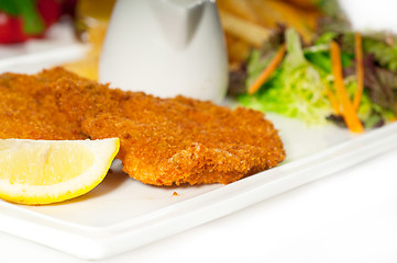 Image showing classic Milanese veal cutlets and vegetables