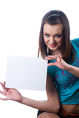 Image showing Young beautiful woman holding blank poster