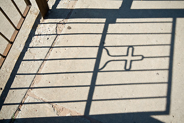 Image showing Shadow of a Gate with a Cross in it