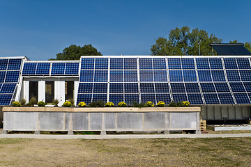 Image showing PV Solar Panel Array Mounted on Home Blue Sky