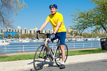 Image showing Senior Man With Helmet Sitting on a Bicycle