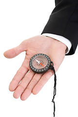 Image showing Man's Hand Suit Sleeve Holding Compass Isolated on White Backgro