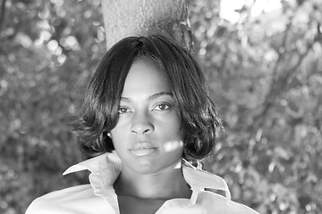 Image showing African American Woman Leaning Tree Black White