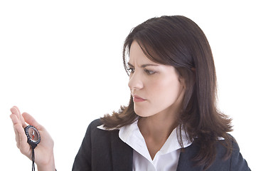 Image showing White Woman Looking at Intently at Compass Isolated Background